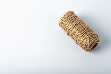 Spool rope on white background. Isolated. Embroidery thread yarn isolated, wool knitting.