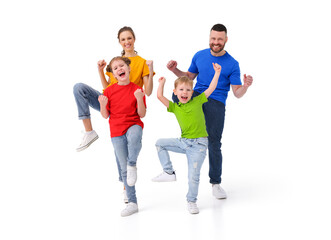 Excited family celebrating victory together in studio