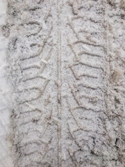 Car wheel footprint in the snow