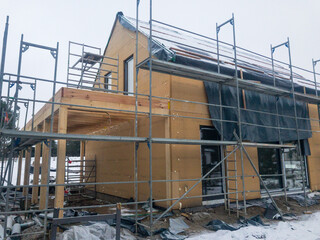 building under construction. New wooden block technology. Building site at winter time