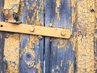 old wooden door closeup Aqua and yellow colour 
