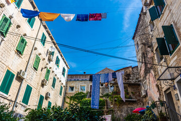 Clothes hanging between old buildings in the historic center in Split, Croatia