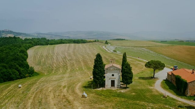 Vitaleta Chapel aerial view in the wonderful valley of Orcia, Tuscany. Drone footage.