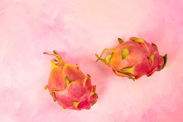 Dragon fruit on pink textured background