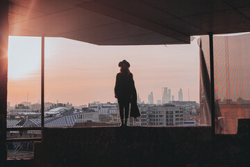 Girl in a scarf on the roof