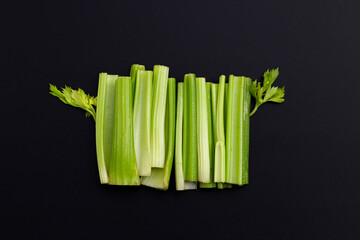 Fresh celery on dark background.