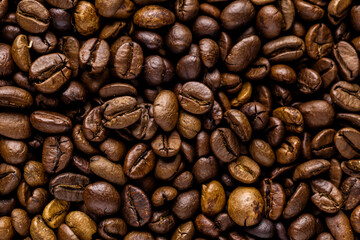 Fresh roasted coffee bean background. Background of roasted coffee beans, top view