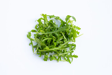 Fresh green rocket salad on white background.