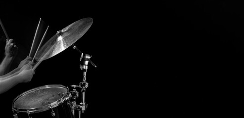 Stroboscopic drummer hitting cymbals with drum sticks