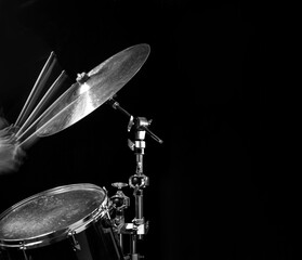 Fototapeta na wymiar Stroboscopic drummer hitting cymbals with drum sticks
