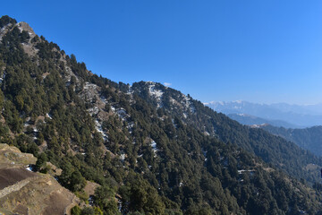 landscape nature view top of mountain covered little bit with snow.