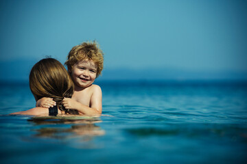 Happy mom and kid concept. Summer vacation on the sea.