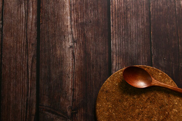 Simple and dark mood of a wooden table for background purposes.