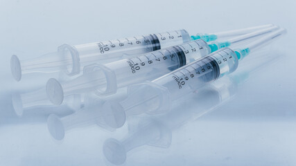 Medicine, Injection, vaccine and disposable syringe isolated, drug concept. Sterile vial medical. Medical Syringe needle. Macro close up on backgrounds gray.