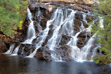 Beautiful Campton Falls in scenic tree-lined gorge along Beebe River in New Hampshire.