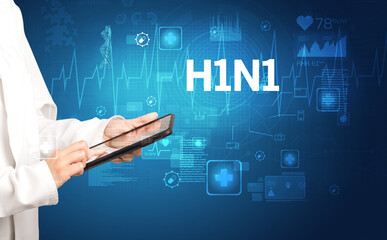 young doctor writing down notes with H1N1 inscription, healthcare concept