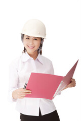Business woman wearing a safety helmet
