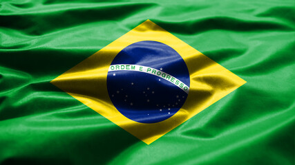 Brazilian flag waving in the wind. Close up of Brazil banner blowing smooth silk