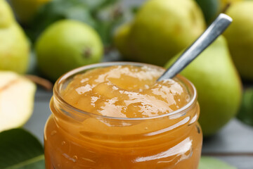 Delicious pear jam in glass jar, closeup