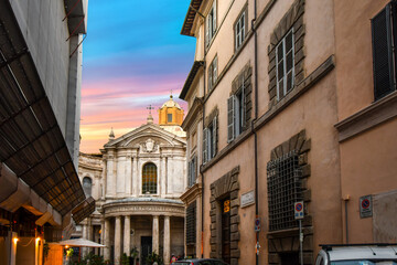 Fototapeta premium A typical Roman street in the Ponte District of Rome, Italy, leads to the Santa Maria della Pace, a small church near the Piazza Navona in Rome Italy.