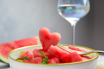 Delicious salad with watermelon in bowl, closeup