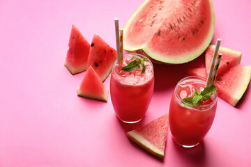 Tasty watermelon drink with mint on pink background. Space for text