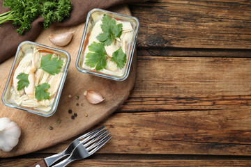 Delicious chicken aspic served on wooden table, flat lay. Space for text