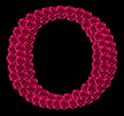 romantic concept image of a capital letter O made of red roses. Isolated on black background. Design element for love or valentines themes