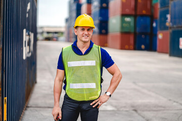 Professional engineer container cargo foreman in helmets working standing and using walkie talkie checking stock into container for loading.logistic and business export