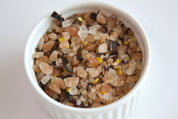 himalaya pink salt with red pepper on white bowl.