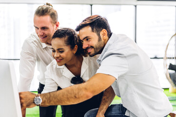 Obraz premium Group of professional business meeting and discussing strategy with new startup project.Creative business people planning and brainstorm with laptop computer in modern office.Teamwork concept