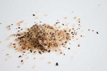 himalaya pink salt with red pepper isolated on white background. 