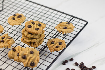 Homemade chocolate chips cookies on marble white background. 