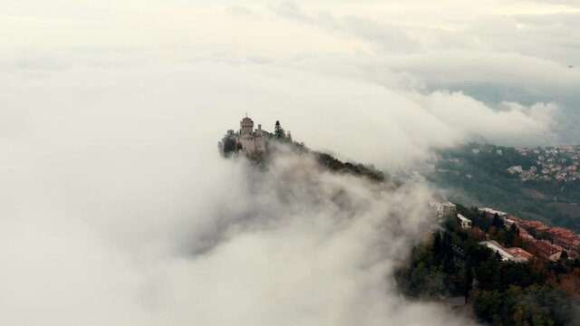 Aerial view on San Marino hidden in the clouds.