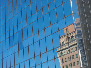 Old building reflected in new
