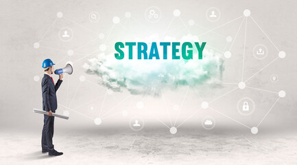 Engineer working on a social media concept with STRATEGY inscription