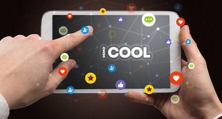 Close-up of a touchscreen with #COOL inscription, social networking concept