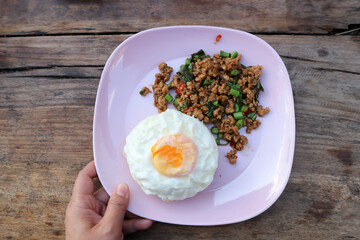 stir fried pork with holy basil and cow pea, fried egg