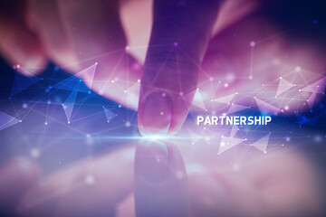 Finger touching tablet with PARTNERSHIP inscription, business concept