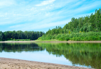 Obraz na płótnie Canvas Blue sky on a calm summer day. Bend of the river in Siberia, forest near water