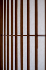 Close-up on a texture of a Washi paper used as Japanese shōji screen on a Kōshi wooden lattice frame.