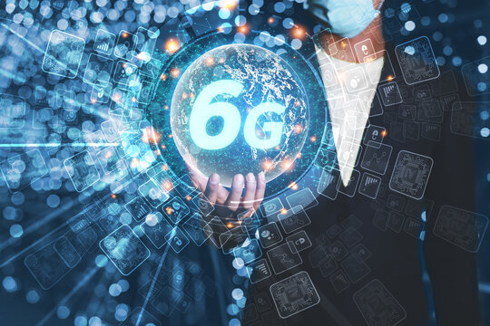 A business man on hand shows a hologram digital network and 6G internet wireless networking. Of the future world