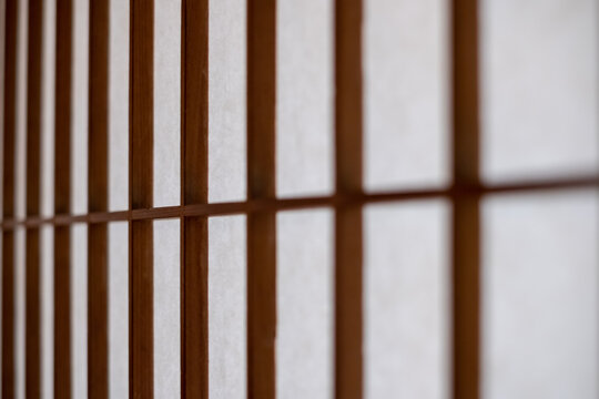 Close-up on a texture of a Washi paper used as Japanese shōji screen on a Kōshi wooden lattice frame.