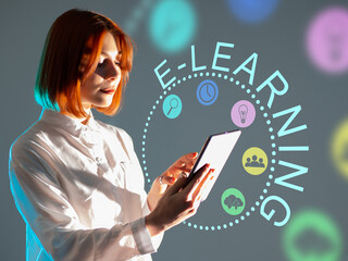 E-learning via tablet app. A tablet computer in the hands of a girl. Application for passing online training. Mobile applications for business training. E-learning symbols next to her.