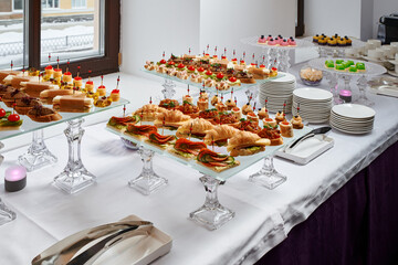 Сatering. Banquet table with different snacks and desserts