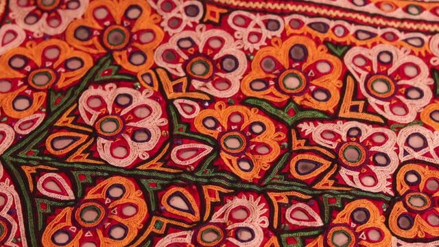embroidery work typical of the Aahir tribe,unidentified man embroidering cloth in traditional method of India,mirror work colorful handmade ahir bharat,Kutch-gujarat