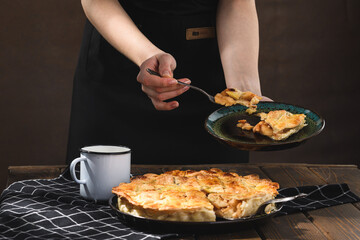 apple pie with milk on a wooden background. Rustic style.