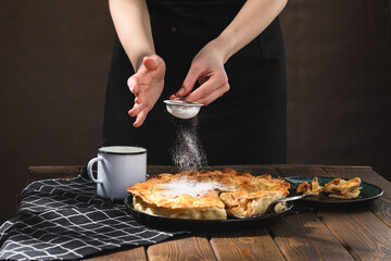 apple pie with milk on a wooden background. Rustic style.