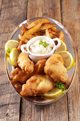 breaded fish, french fries and dipping sauce