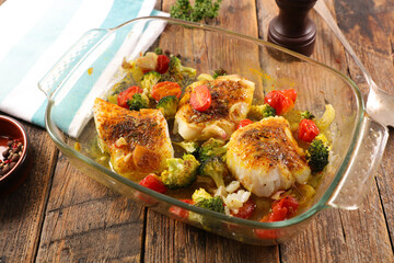 baked fish fillet portion with vegetables
